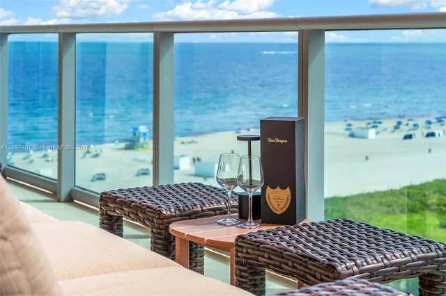 a balcony view with a outdoor seating