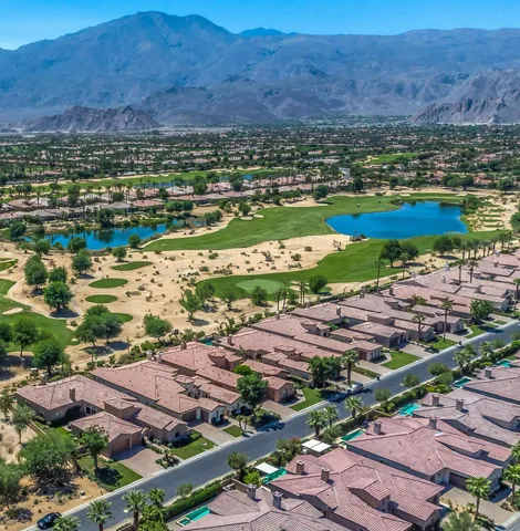an aerial view of residential houses and outdoor space