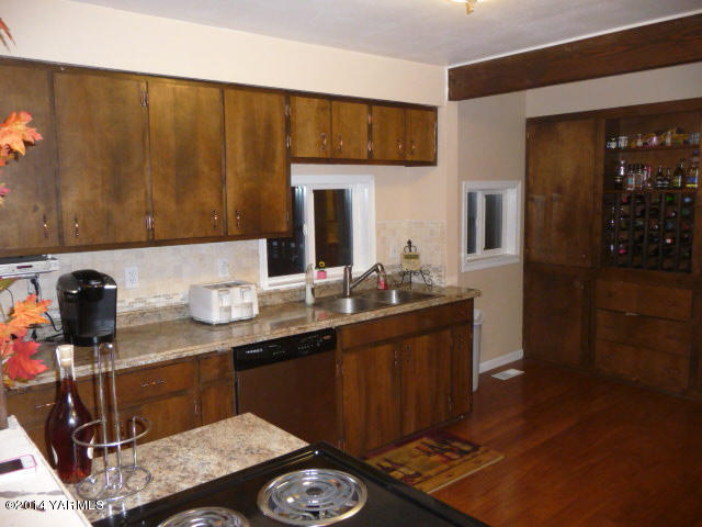 240 Elliott Road Cowiche, WA 98923 - Photo 8 of 50 a kitchen with sink and refrigerator