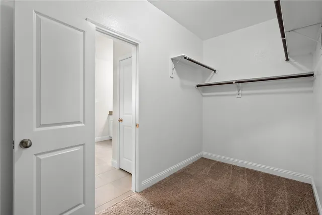 an empty room with windows and entrance