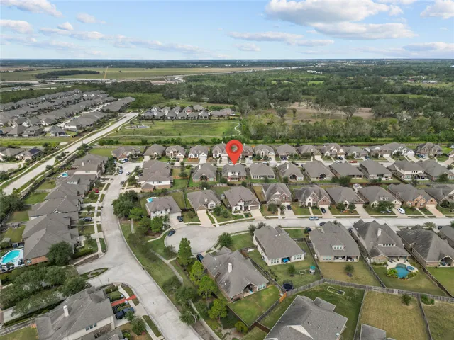 an aerial view of residential houses with outdoor space