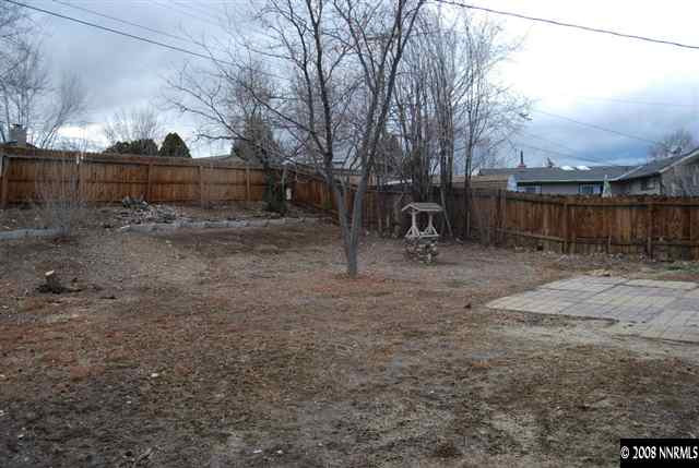 1095 Akard Drive Reno, NV 89503 - Photo 9 of 9 a backyard of a house with lots of green space