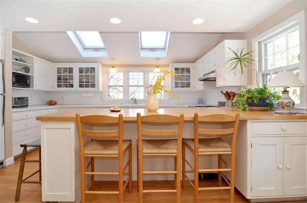 11 Linden Road Barrington, RI 02806 - Photo 3 of 29 a kitchen with granite countertop cabinets and chairs