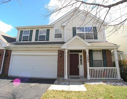 1495 Dearborn Court, Unit 1495 Mount Prospect, IL 60056 - Photo 1 of 1 a front view of a house with a garage