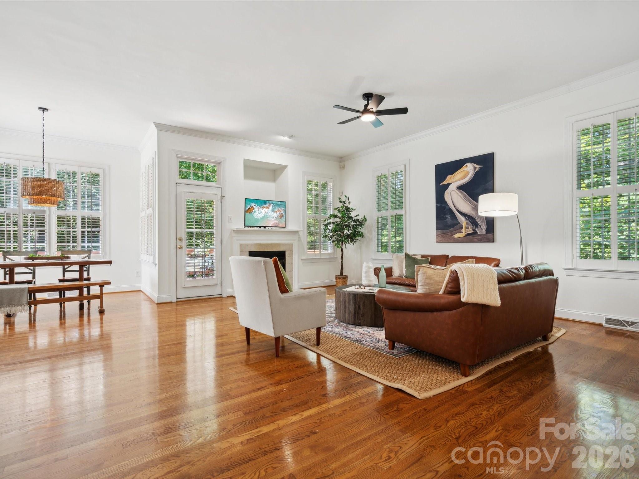 927 Derick's Crossing Fort Mill, SC 29708 - Photo 13 of 48 a living room with furniture a large window and wooden floor