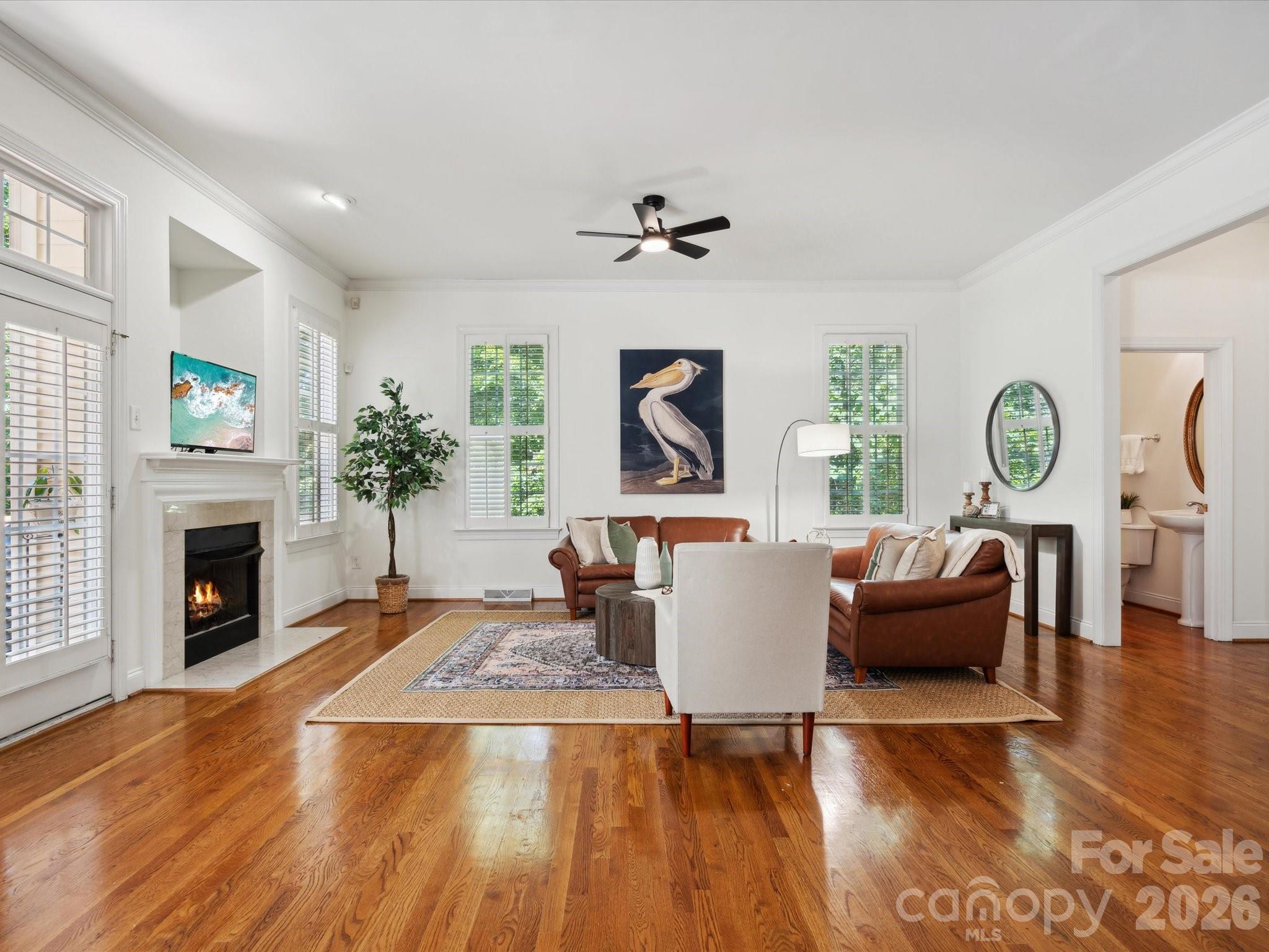 927 Derick's Crossing Fort Mill, SC 29708 - Photo 16 of 48 a living room with furniture a fireplace and a table