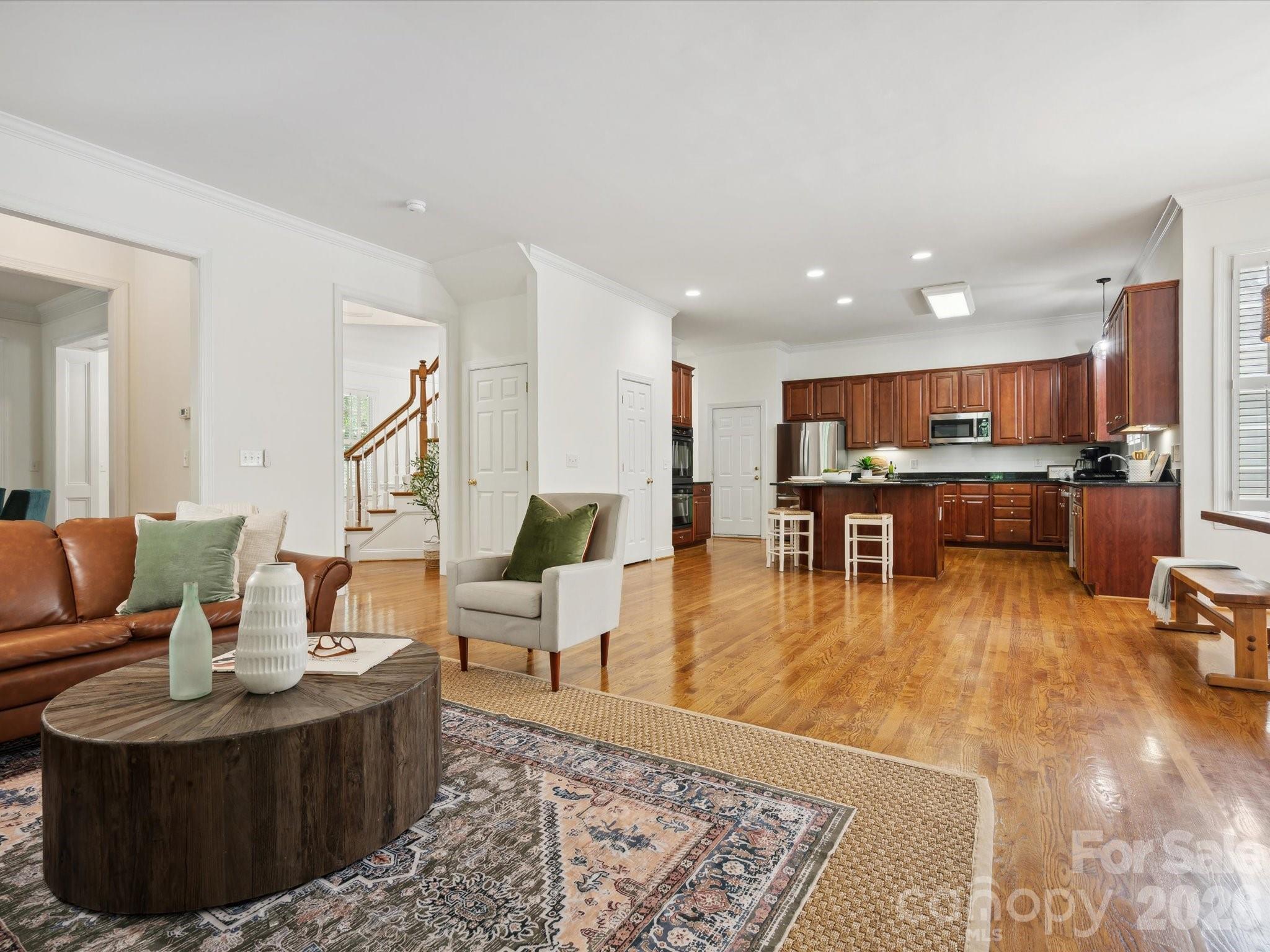 927 Derick's Crossing Fort Mill, SC 29708 - Photo 17 of 48 a living room with furniture and kitchen view