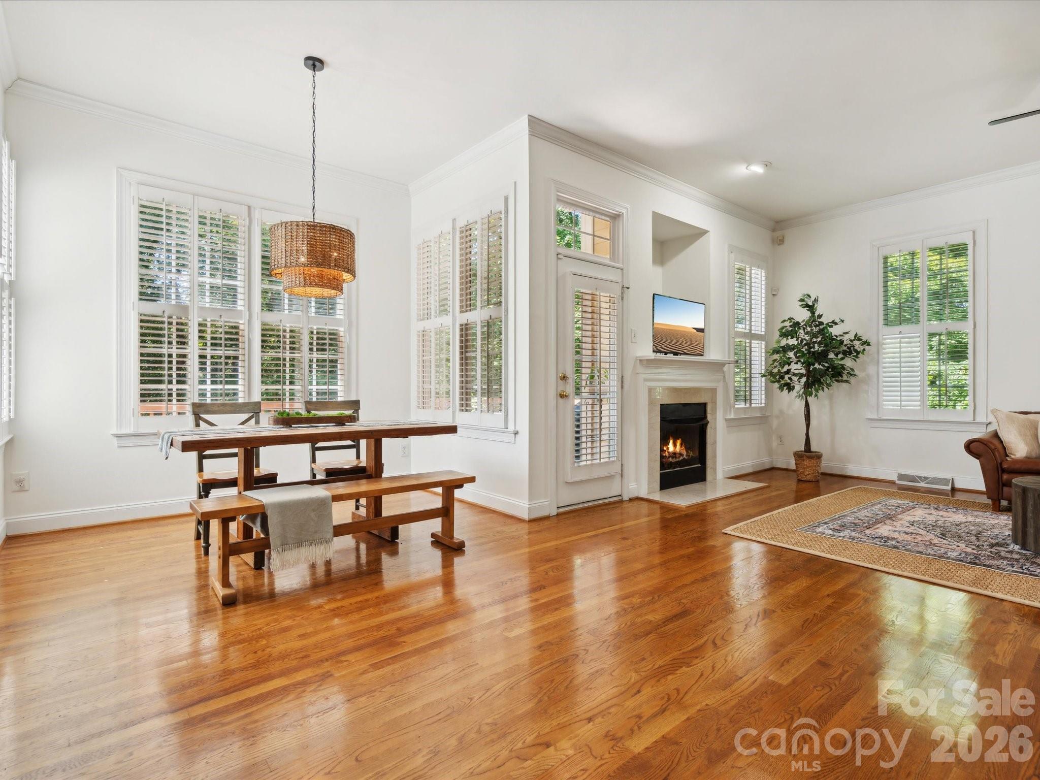 927 Derick's Crossing Fort Mill, SC 29708 - Photo 18 of 48 a living room with fireplace furniture and a wooden floor