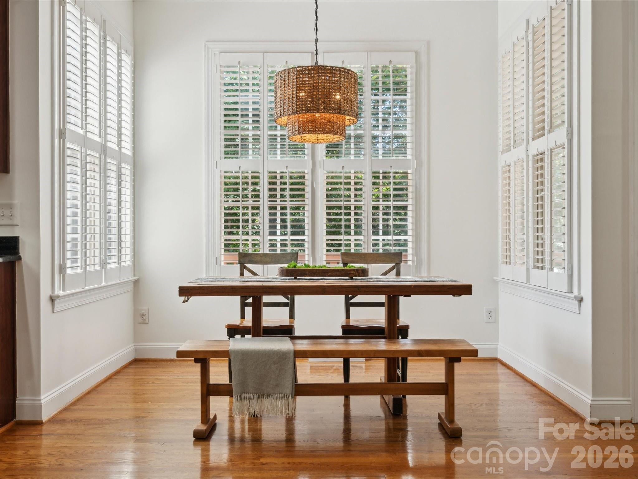 927 Derick's Crossing Fort Mill, SC 29708 - Photo 19 of 48 a view of a dining room with furniture and wooden floor