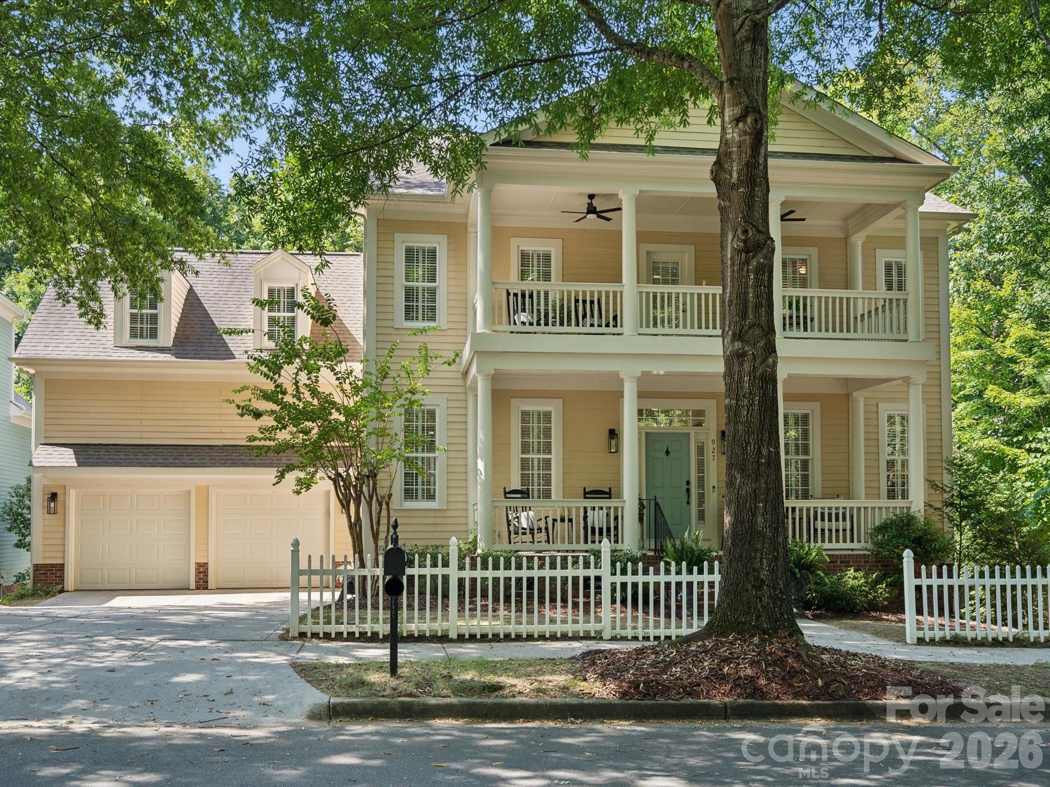 927 Derick's Crossing Fort Mill, SC 29708 - Photo 2 of 48 a front view of a house with a garden