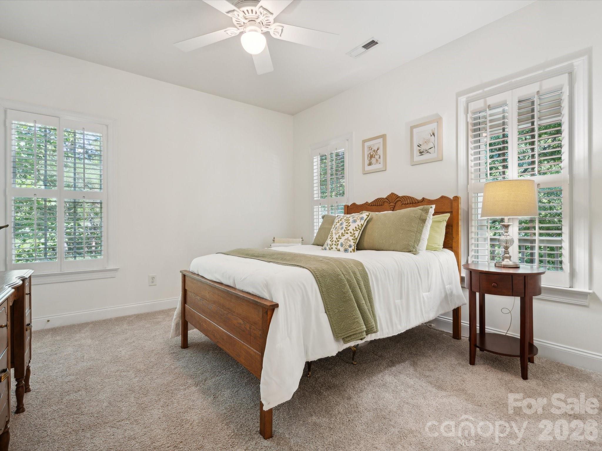 927 Derick's Crossing Fort Mill, SC 29708 - Photo 30 of 48 a spacious bedroom with a bed and a table