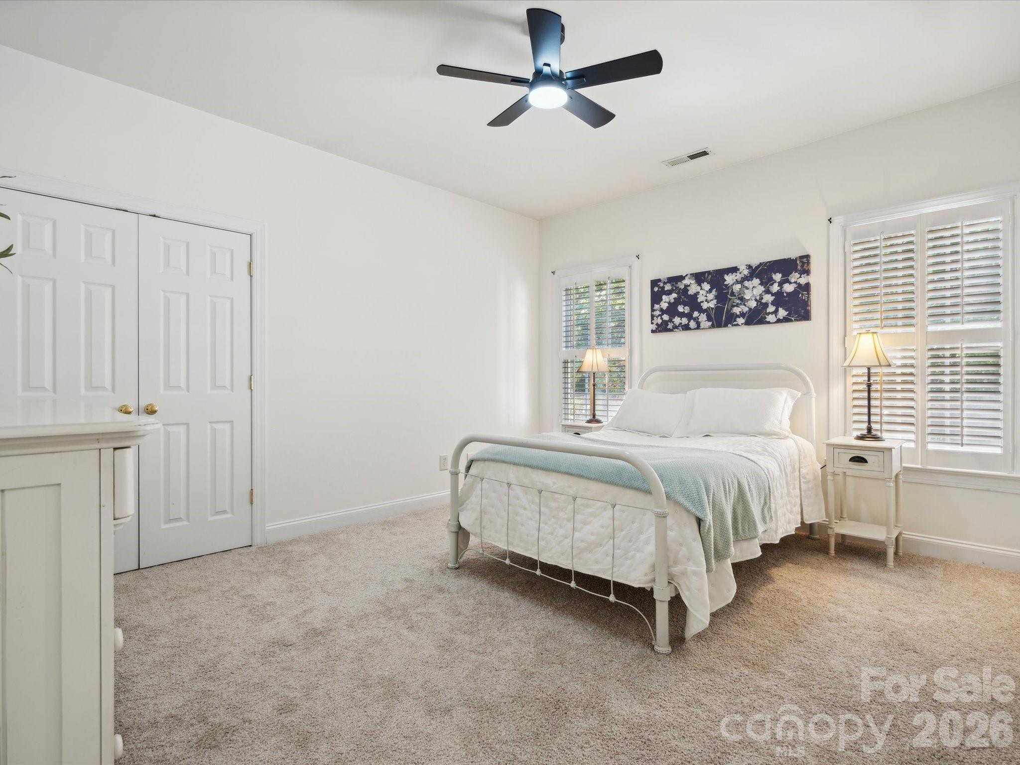 927 Derick's Crossing Fort Mill, SC 29708 - Photo 32 of 48 a spacious bedroom with a bed and a cabinets