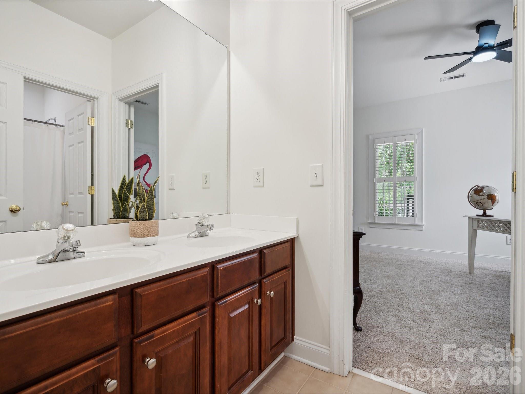 927 Derick's Crossing Fort Mill, SC 29708 - Photo 33 of 48 a bathroom with a double vanity sink and a mirror