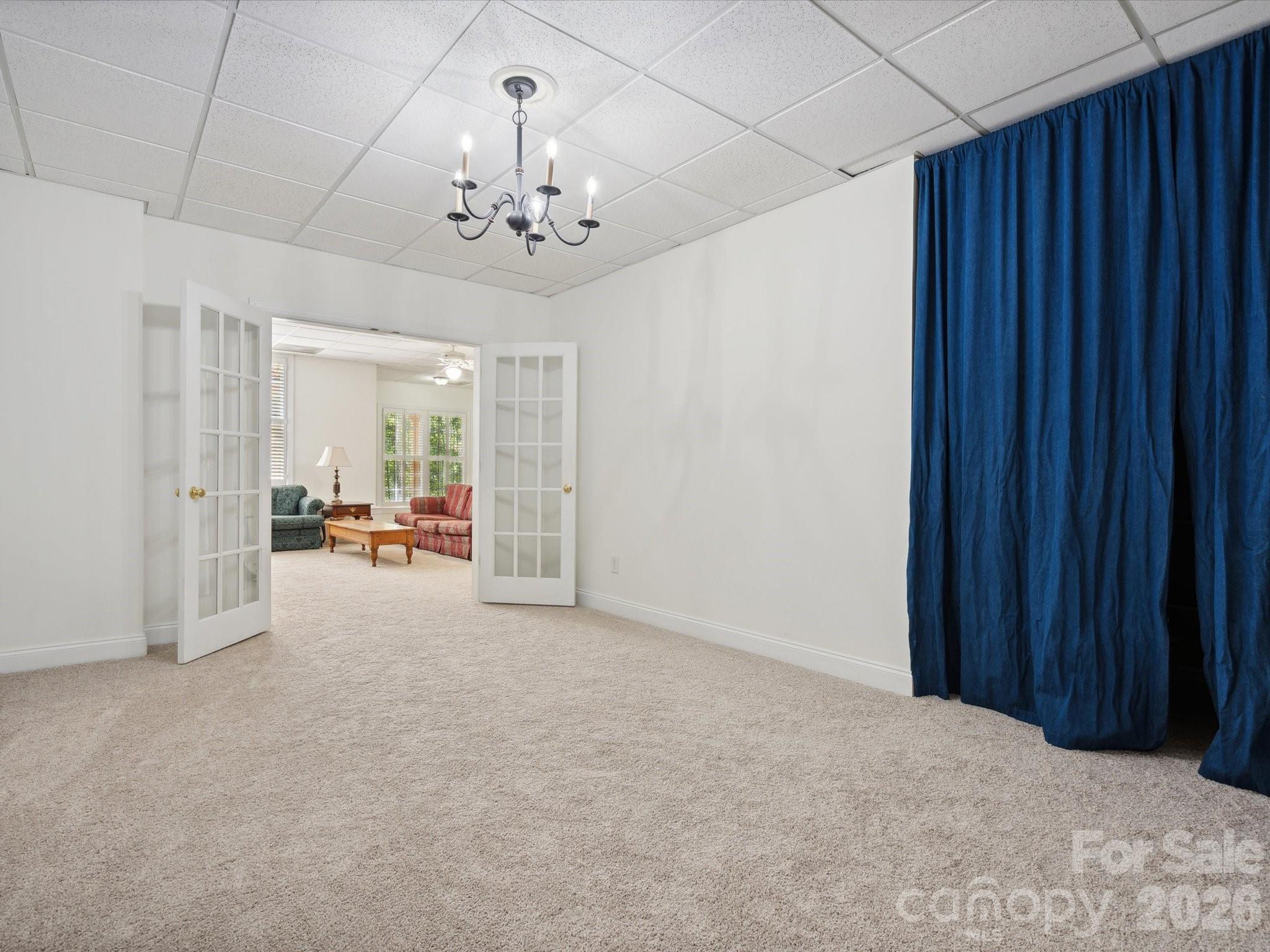 927 Derick's Crossing Fort Mill, SC 29708 - Photo 41 of 48 a view of a livingroom with a chandelier furniture and windows