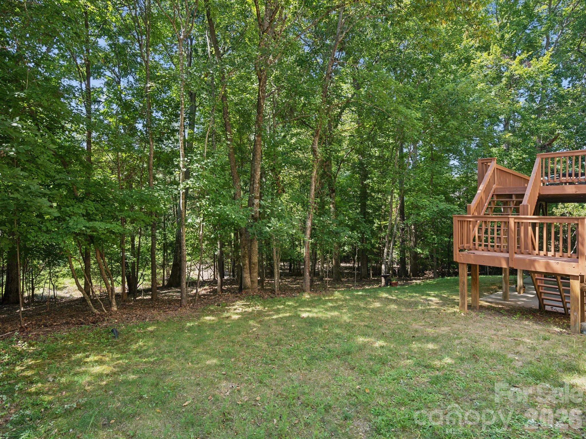 927 Derick's Crossing Fort Mill, SC 29708 - Photo 48 of 48 a backyard of a house with table and chairs