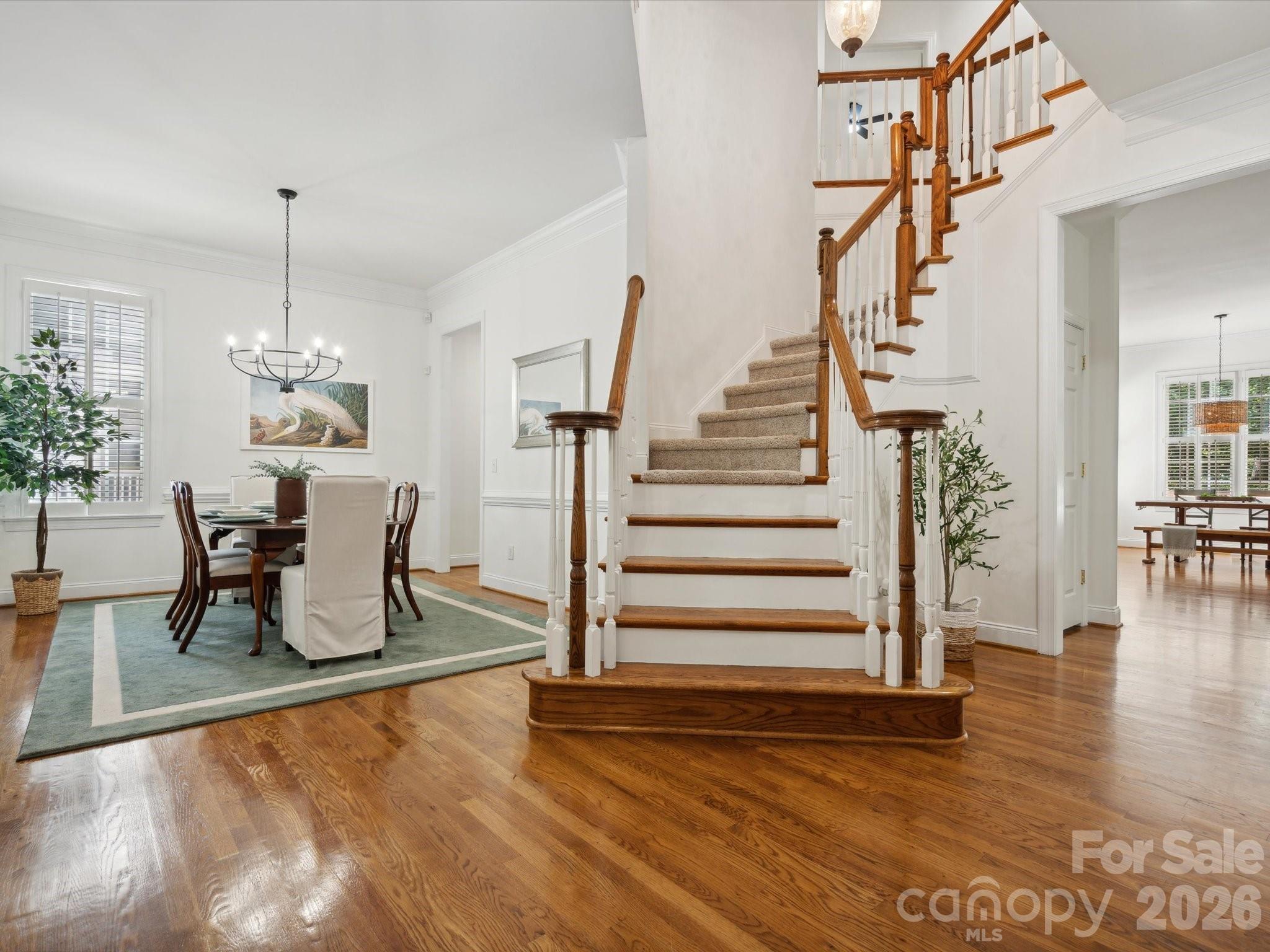 927 Derick's Crossing Fort Mill, SC 29708 - Photo 7 of 48 a dining room with furniture entryway and wooden floor