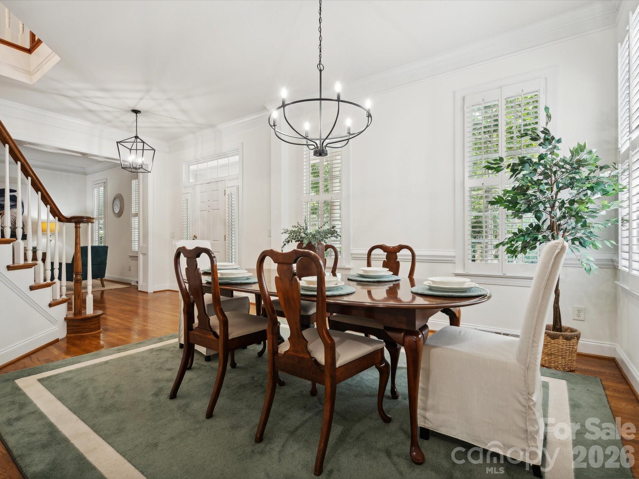927 Derick's Crossing Fort Mill, SC 29708 - Photo 8 of 48 a view of a dining room with furniture and wooden floor