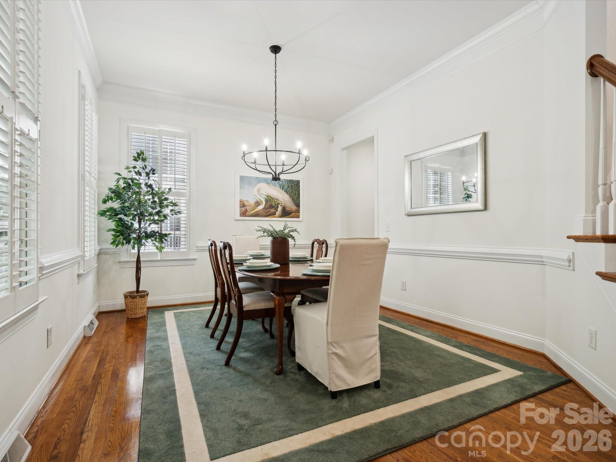 927 Derick's Crossing Fort Mill, SC 29708 - Photo 9 of 48 a view of a dining room with furniture window and wooden floor