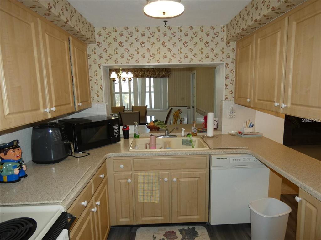 4392 Craftsbury Drive New Port Richey, FL 34652 - Photo 11 of 41 a kitchen with a sink and cabinets