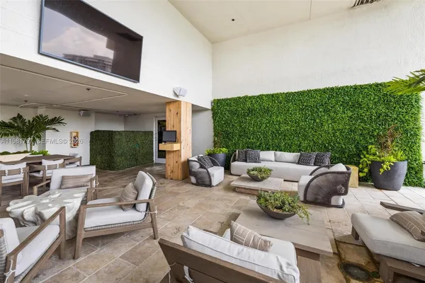 a outdoor living space with furniture and garden view