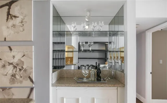 a kitchen with a refrigerator and cabinets