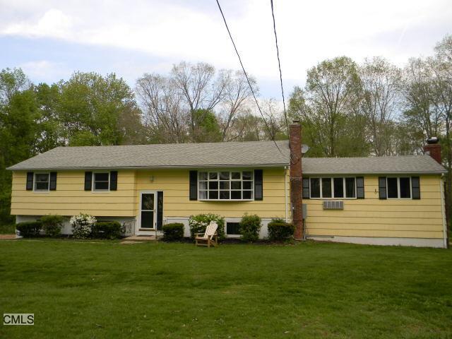 7 Vining Road Bethel, CT 06801 - Photo 1 of 1 a front view of a house with a garden