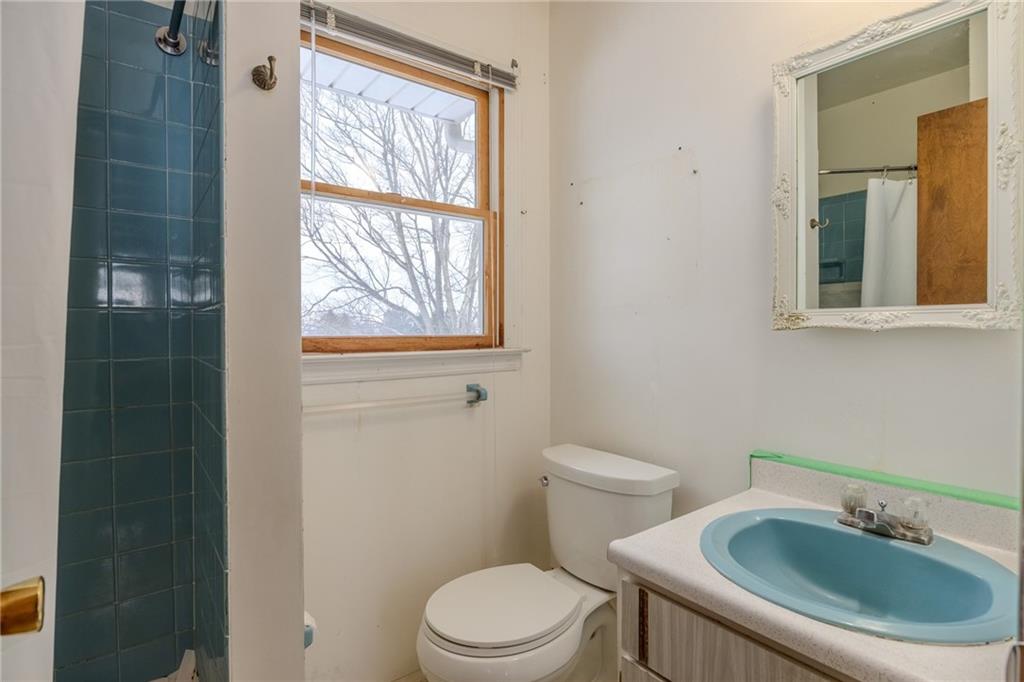 1142 Apples Mill Road West Newton, PA 15089 - Photo 16 of 32 a white toilet sitting next to a bathroom sink