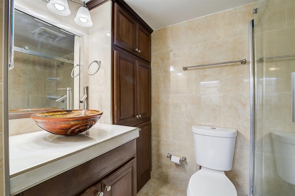 7940 Northwest 50th Street, Unit 203 Lauderhill, FL 33351 - Photo 12 of 36 a bathroom with a toilet a sink and shower