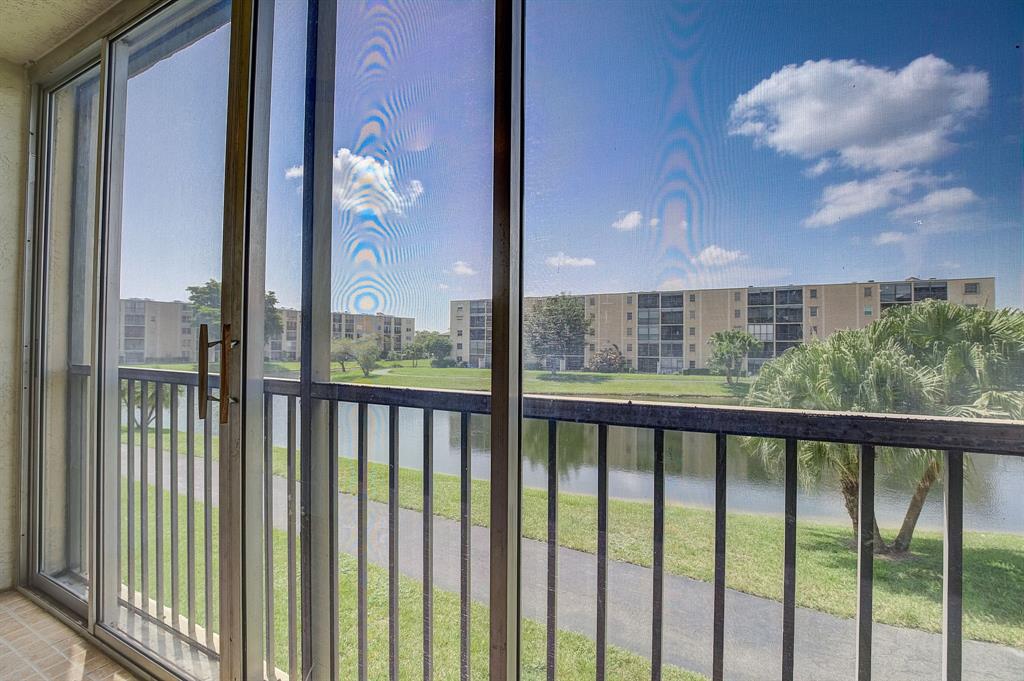7940 Northwest 50th Street, Unit 203 Lauderhill, FL 33351 - Photo 21 of 36 a view of a balcony with a plants