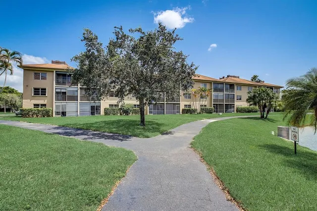 a view of swimming pool with outdoor seating and plants