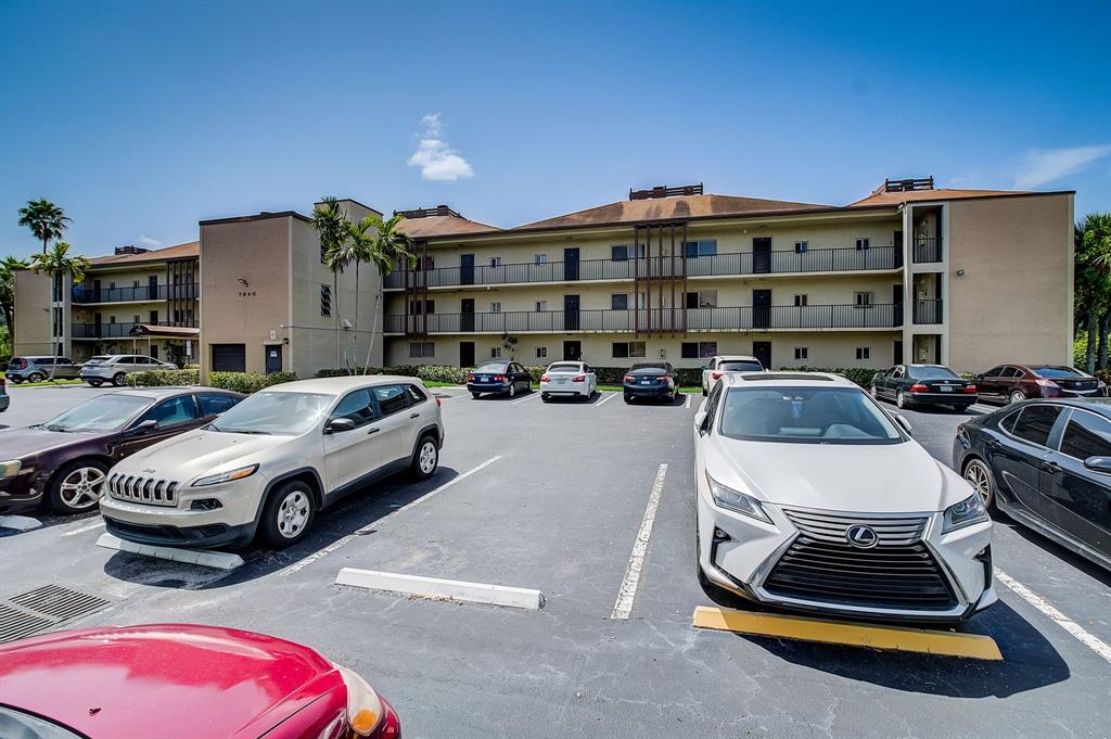 7940 Northwest 50th Street, Unit 203 Lauderhill, FL 33351 - Photo 34 of 36 a car parked in front of a house