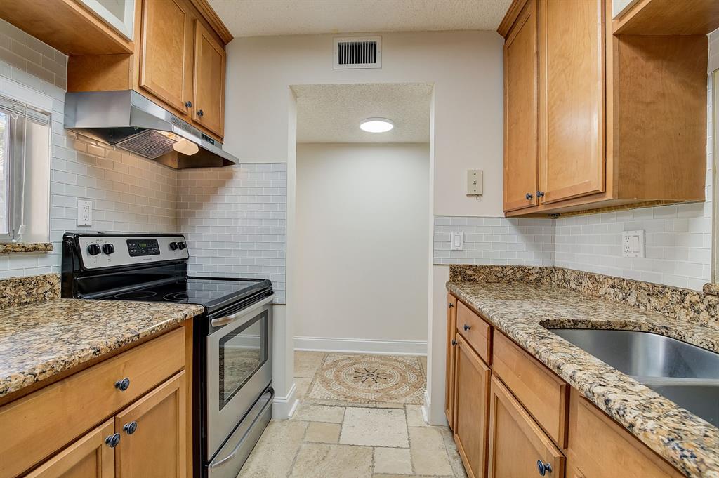 7940 Northwest 50th Street, Unit 203 Lauderhill, FL 33351 - Photo 8 of 36 a kitchen that has a sink and a stove