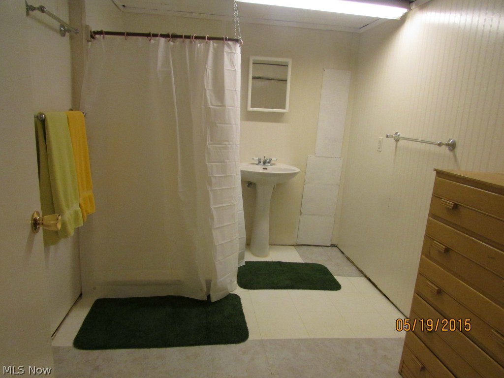 3335 Sandy Lake Road Ravenna, OH 44266 - Photo 11 of 18 There is a shower and a sink in the lower level. It would be easy to add a toilet. It is city sewer.