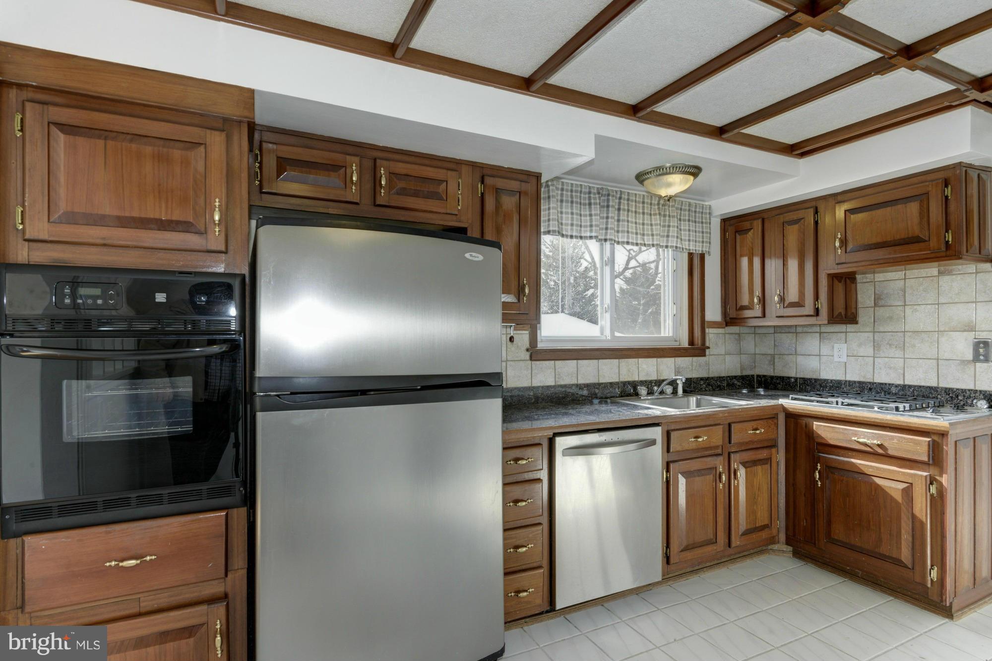905 Arran Road Baltimore, MD 21239 - Photo 13 of 30 Kitchen with granite, SS appliances, cherry cabs