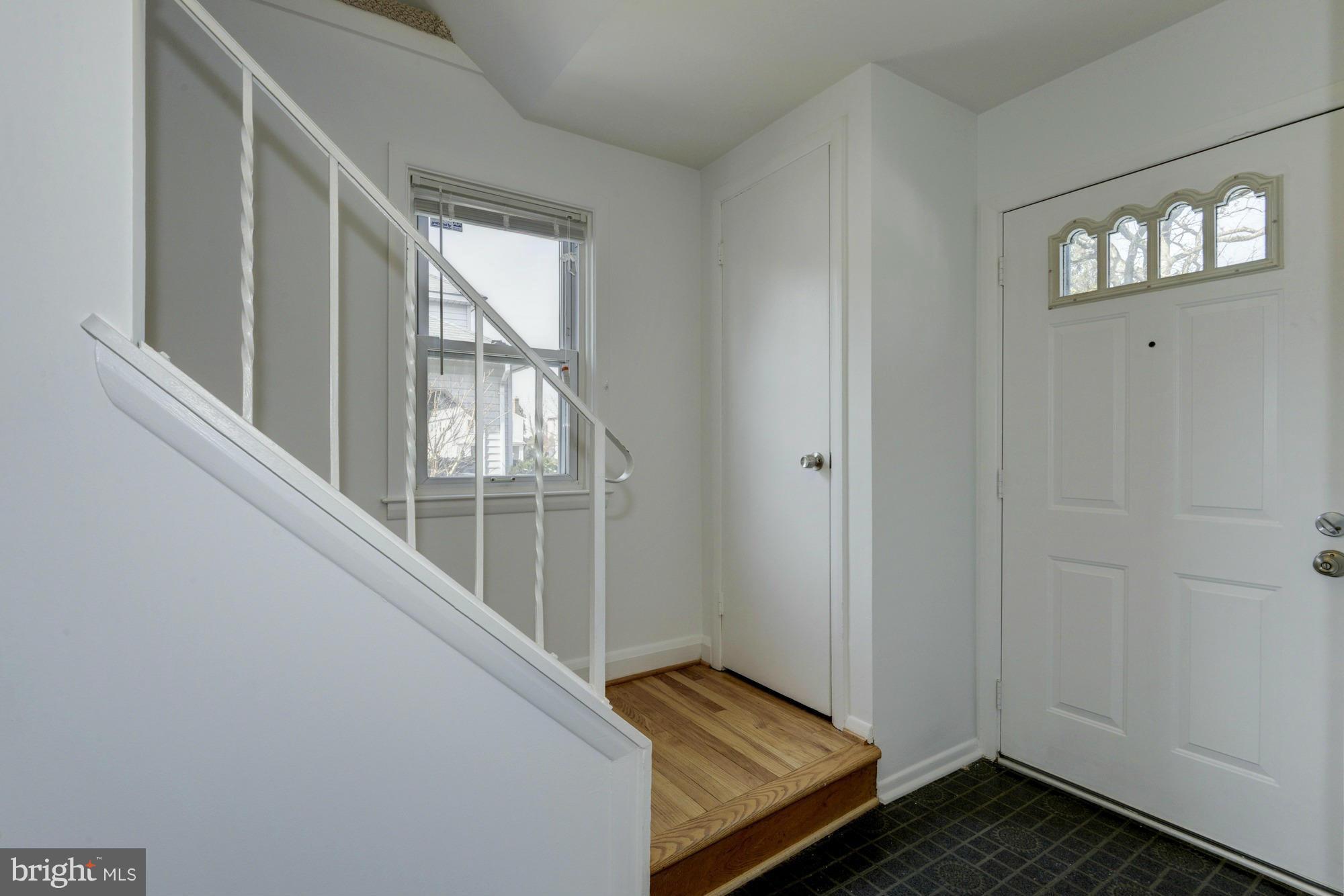 905 Arran Road Baltimore, MD 21239 - Photo 5 of 30 Coat closet at base of stairs by front door.