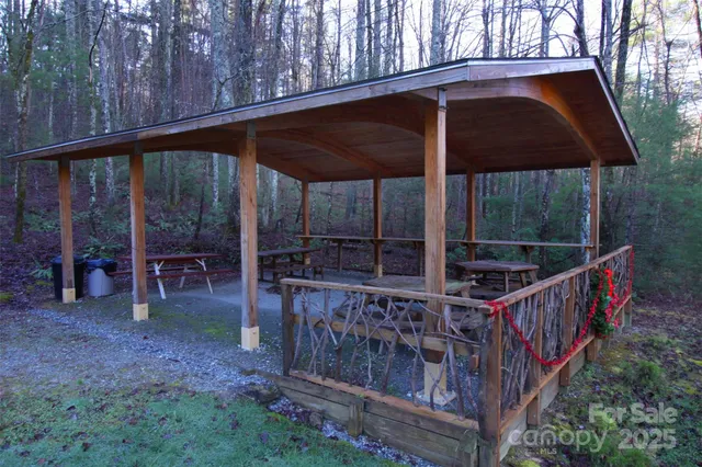 a view of a roof deck with wooden floor and fence