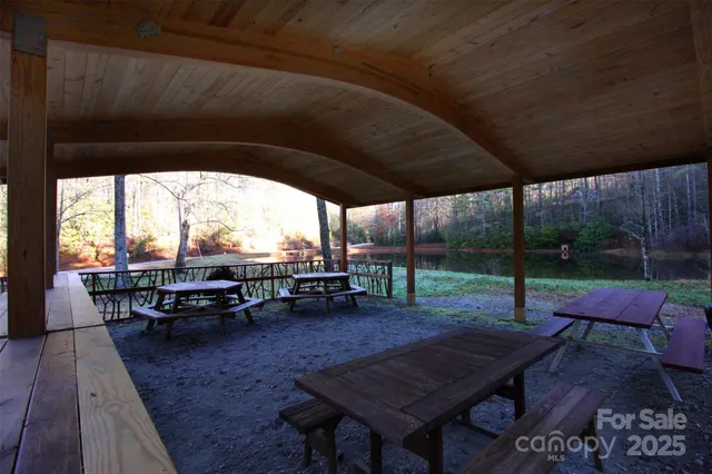 a view of a patio with table and chairs and wooden floor