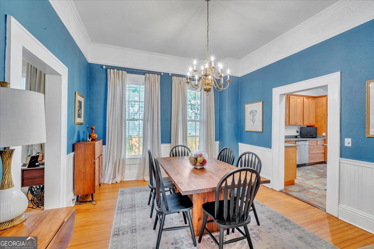 712 Stonewall Street Dublin, GA 31021 - Photo 11 of 65 a view of a dining room with furniture and wooden floor