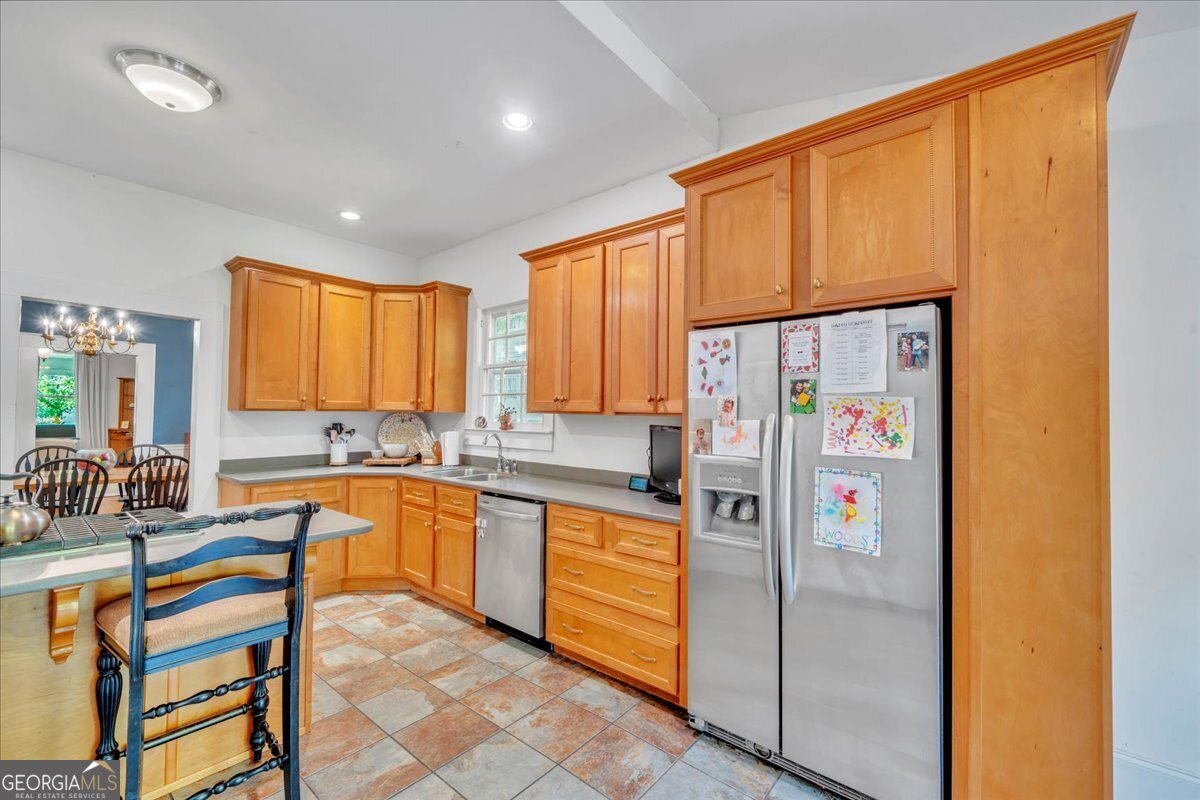 712 Stonewall Street Dublin, GA 31021 - Photo 15 of 65 a kitchen with stainless steel appliances granite countertop a refrigerator and a stove top oven