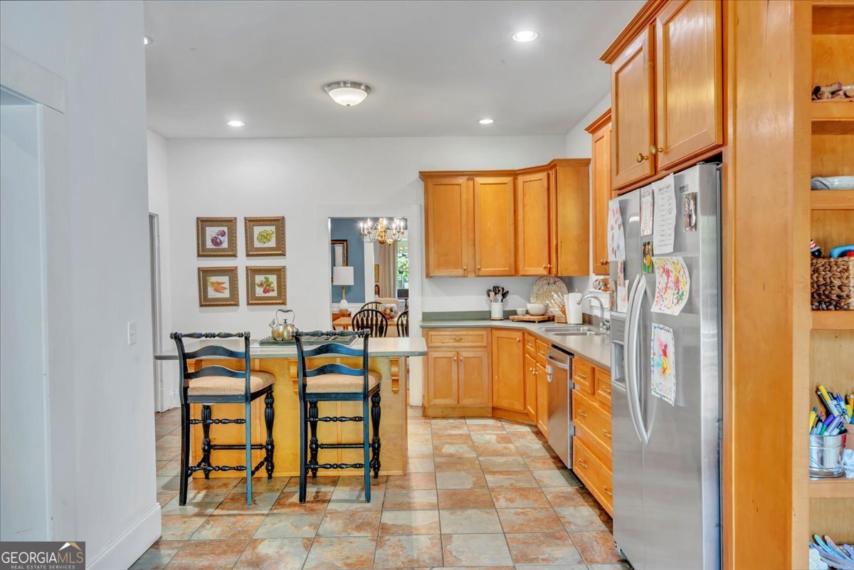 712 Stonewall Street Dublin, GA 31021 - Photo 18 of 65 a large kitchen with lots of table and chairs