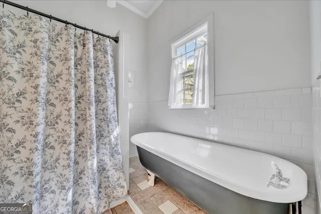 a bathroom with a toilet a sink and a mirror