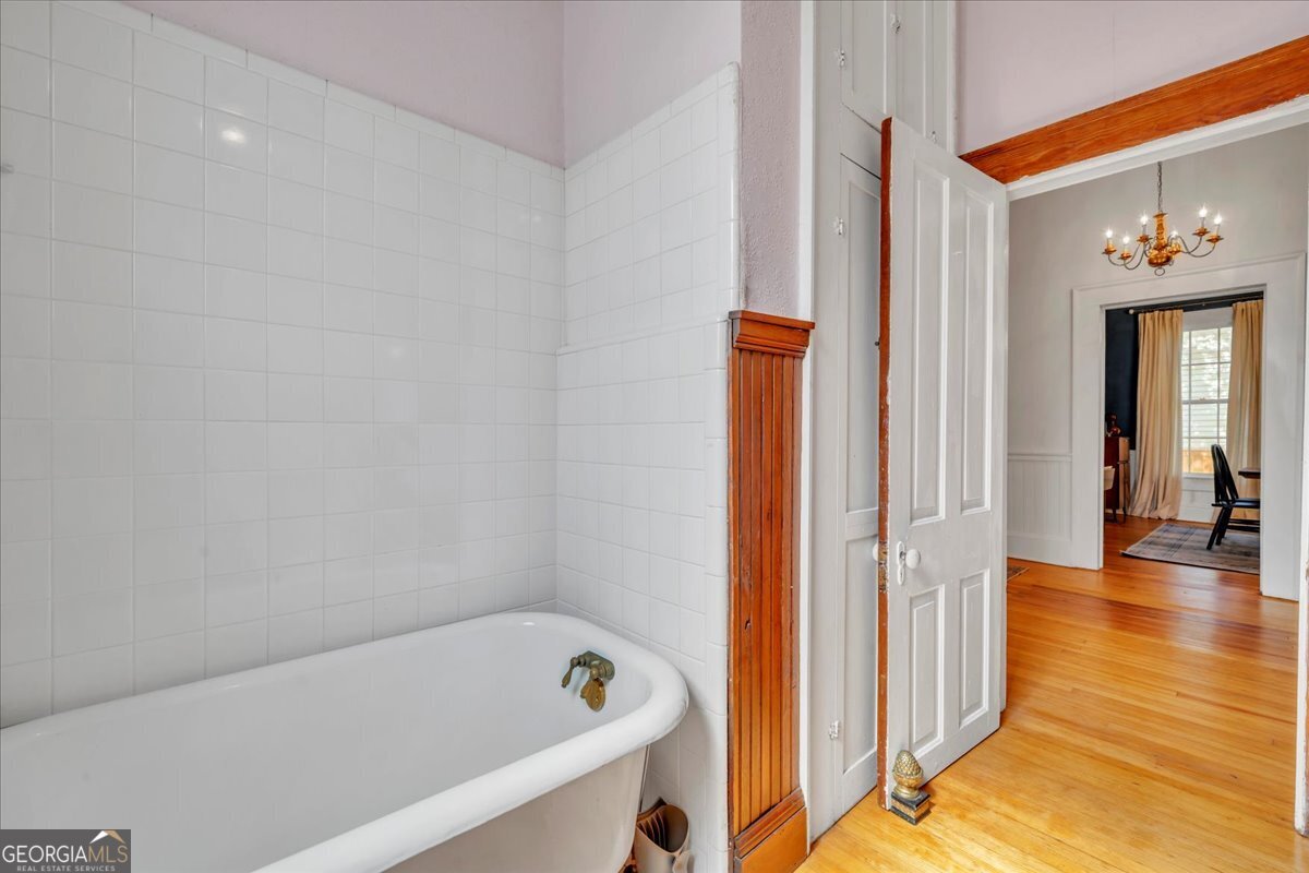 712 Stonewall Street Dublin, GA 31021 - Photo 28 of 65 a bathroom with a bathtub and a shower