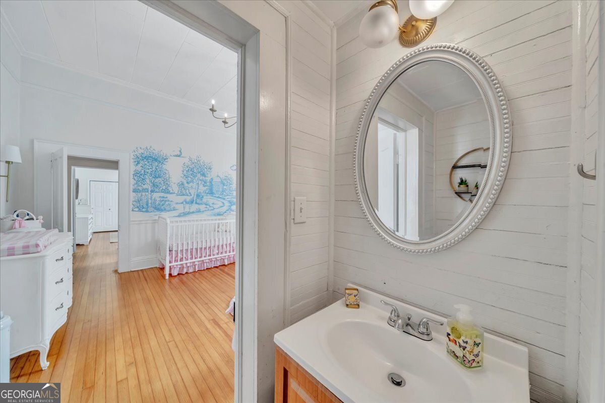 712 Stonewall Street Dublin, GA 31021 - Photo 31 of 65 a bathroom with a sink and a mirror