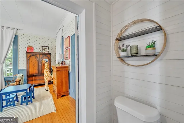 a living room with patio outer view and wooden floor
