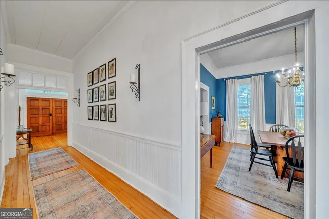 a living room with furniture and a book shelf