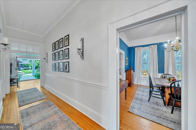 a bedroom with furniture and a wooden floor