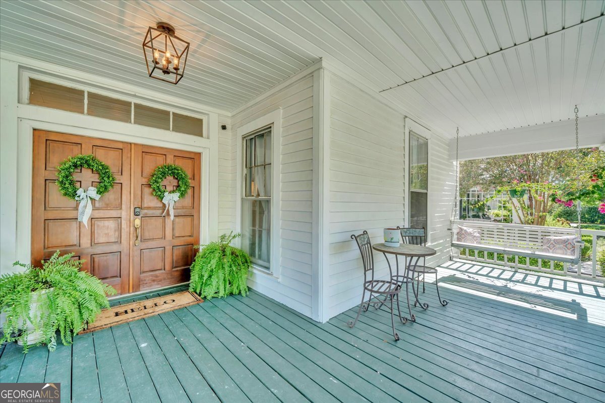 712 Stonewall Street Dublin, GA 31021 - Photo 40 of 65 a view of a porch with furniture and wooden floor