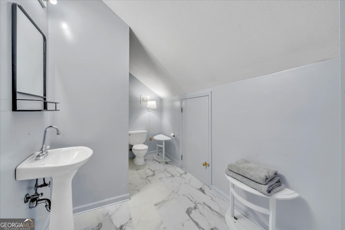 712 Stonewall Street Dublin, GA 31021 - Photo 47 of 65 a bathroom with a sink and a mirror