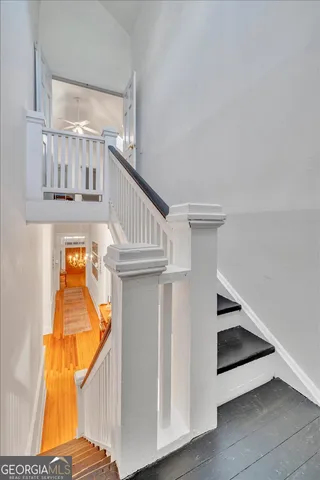 a view of a patio with table and chairs potted plants with wooden floor