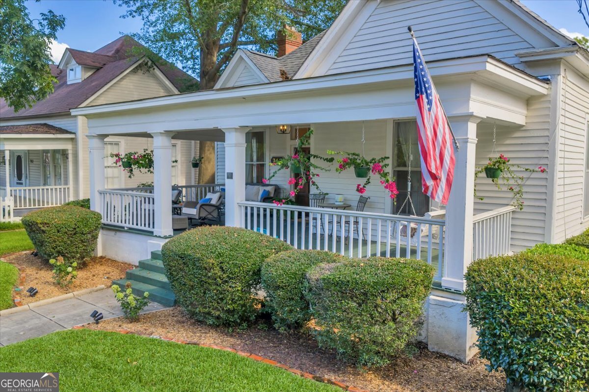 712 Stonewall Street Dublin, GA 31021 - Photo 57 of 65 a view of a porch with a garden